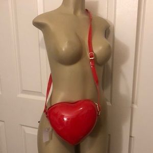 Red plastic heart shaped purse
